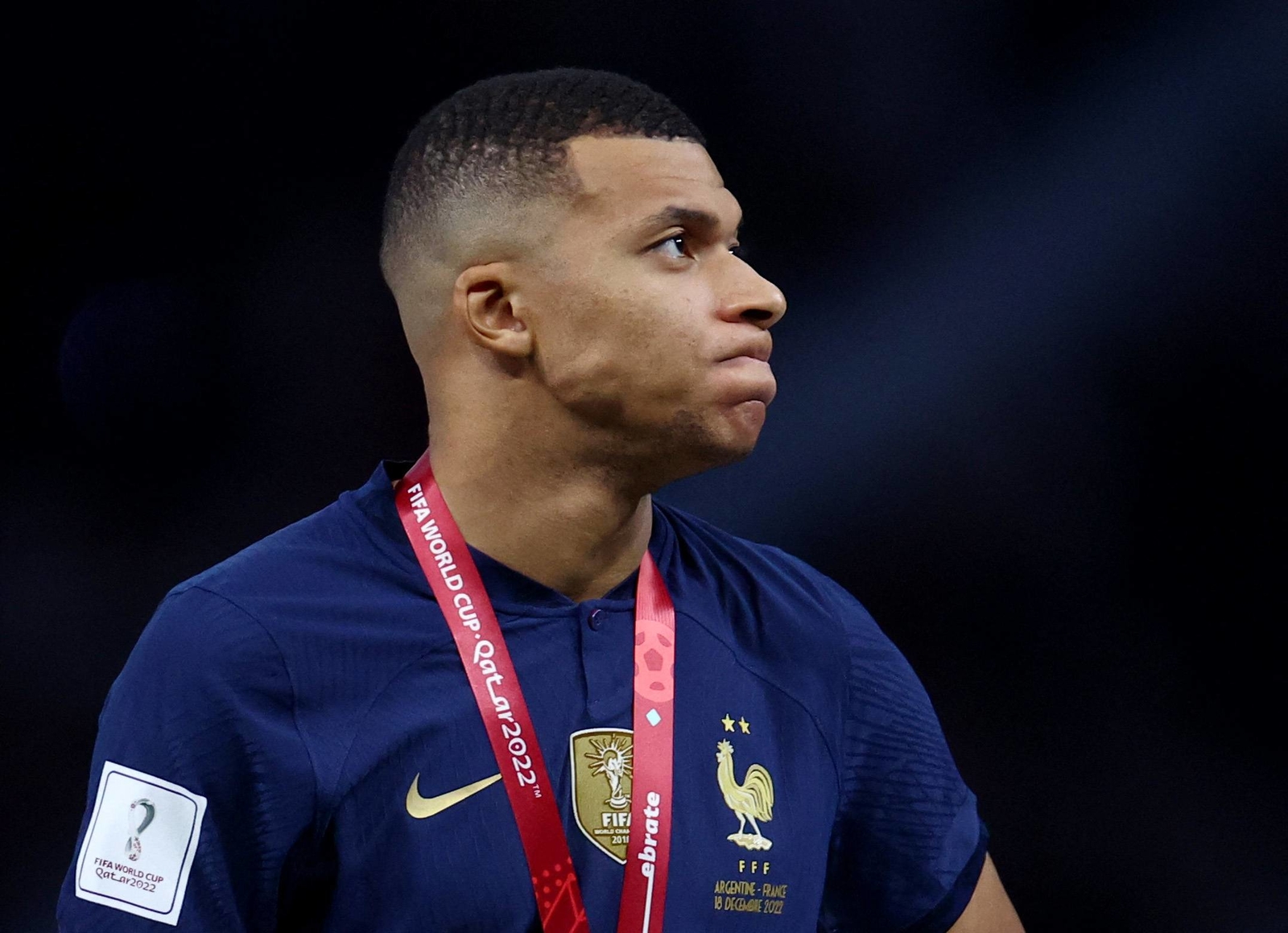 Soccer Football - FIFA World Cup Qatar 2022 - Final - Argentina v France - Lusail Stadium, Lusail, Qatar - December 18, 2022 France's Kylian Mbappe looks dejected during the trophy ceremony REUTERS/Hannah Mckay