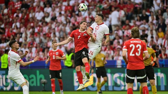 Austria's midfielder #09 Marcel Sabitzer fights for the ball with Poland's midfielder #24 Bartosz Slisz during the UEFA Euro 2024 Group D football match between Poland and Austria at the Olympiastadion in Berlin on June 21, 2024. (Photo by JOHN MACDOUGALL / AFP)